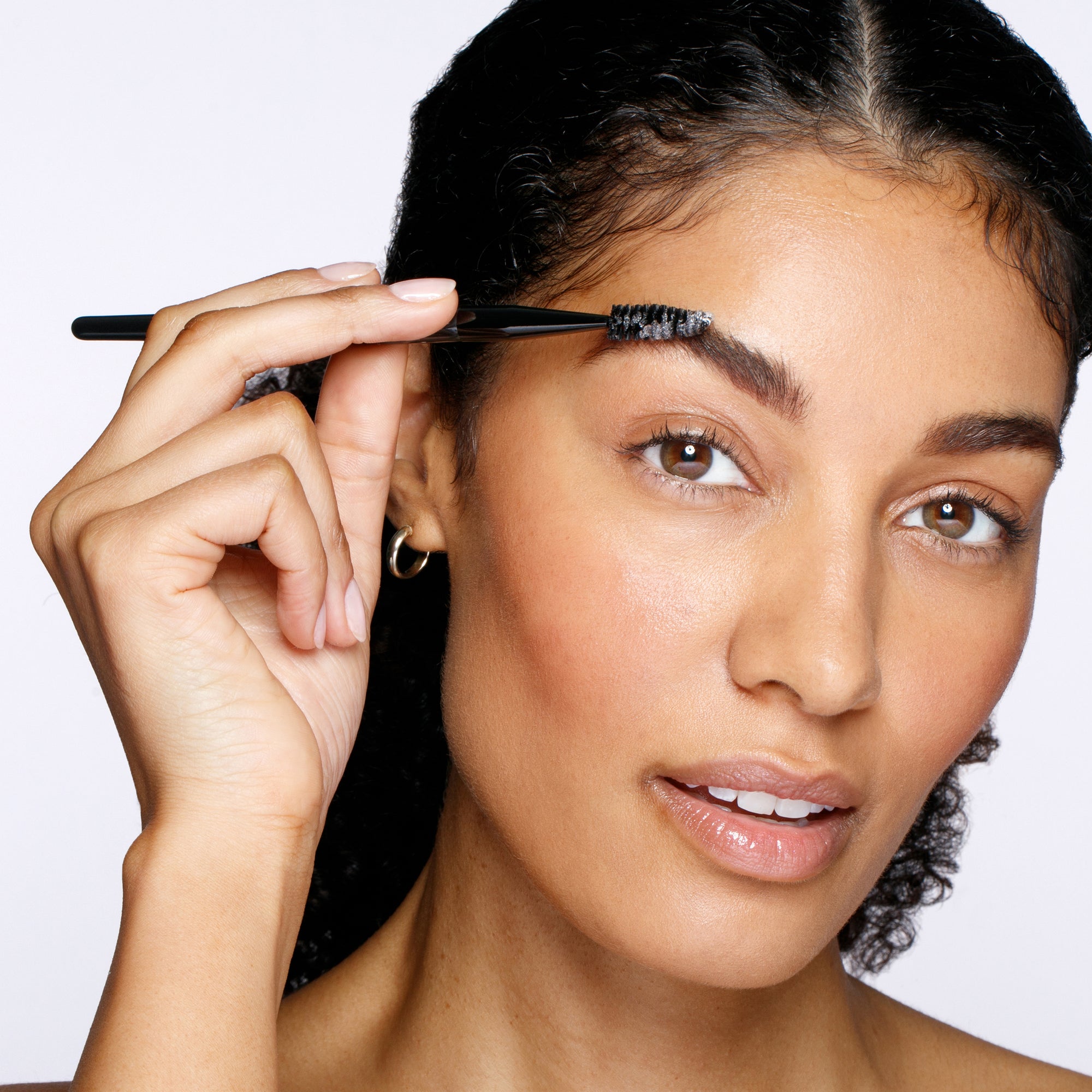 Model using Brow &amp; Lash Brush