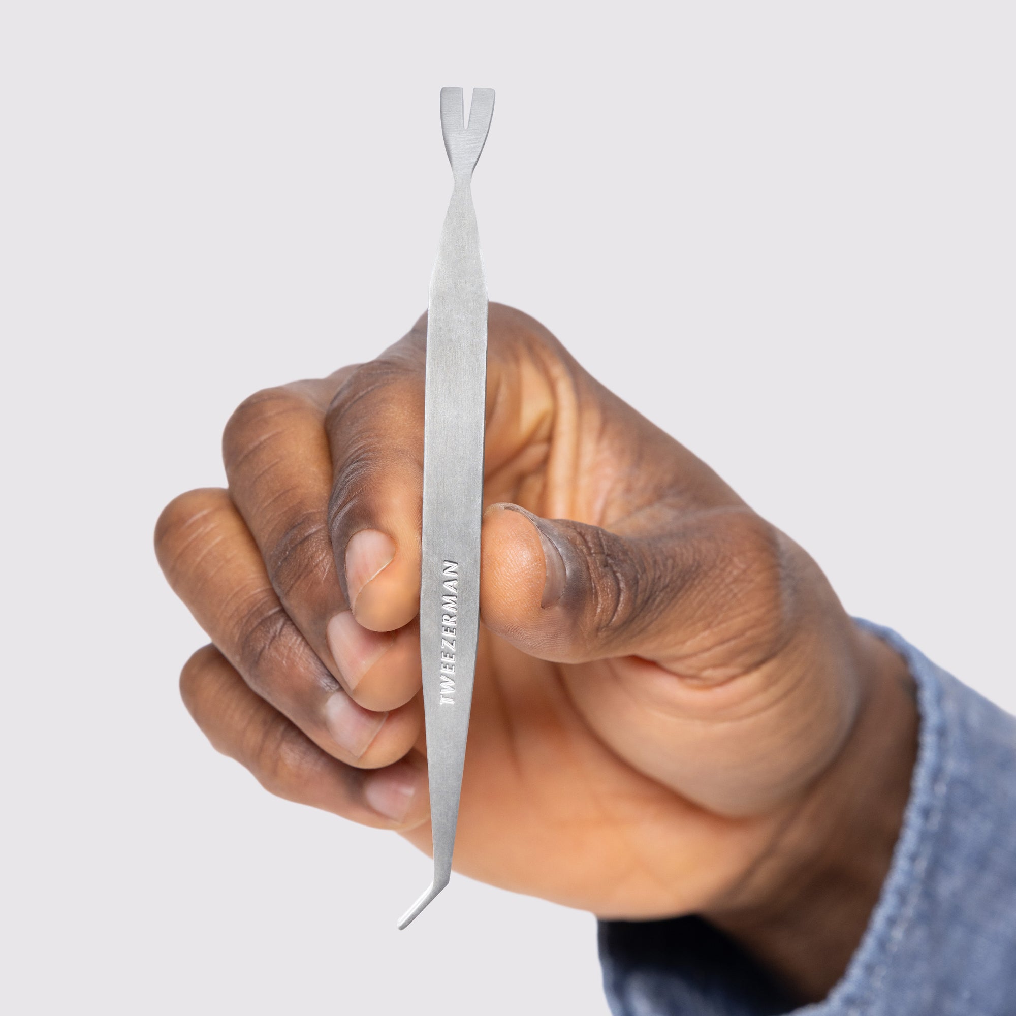 Model holding Pet Tick Removal Tool