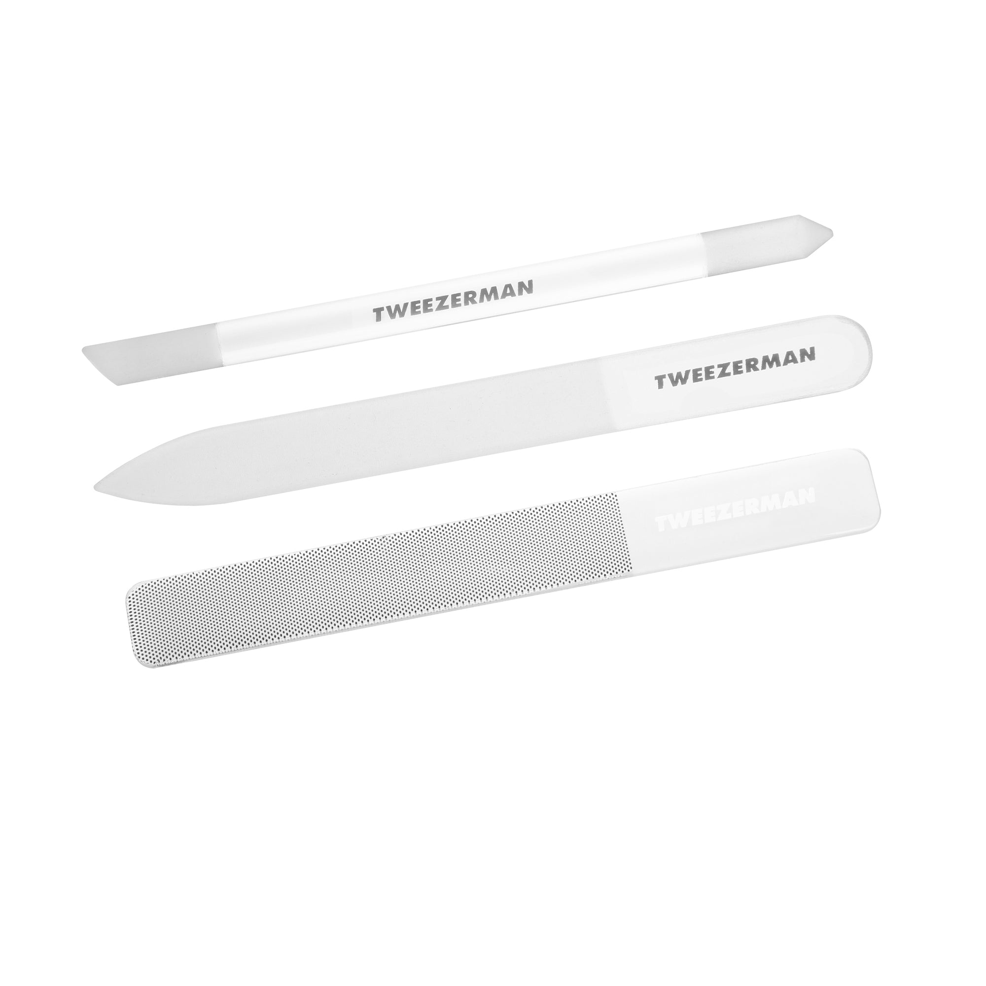 Glass nail file one end is pointed and one end is rounded. Glass cuticle pushy one end is angled and one end is pointed. Glass nail buffer one end is smooth glass and one end has textured grit
All items are glass with grey and white coloring with Tweezerman logo