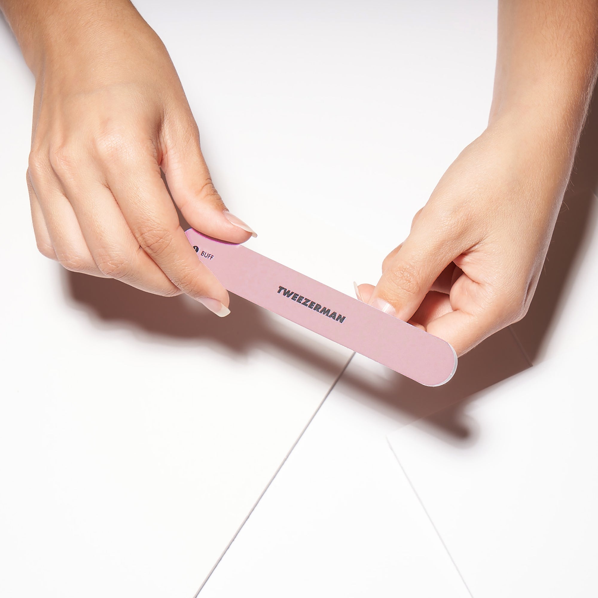 Model using Shine side of Nail Buffer