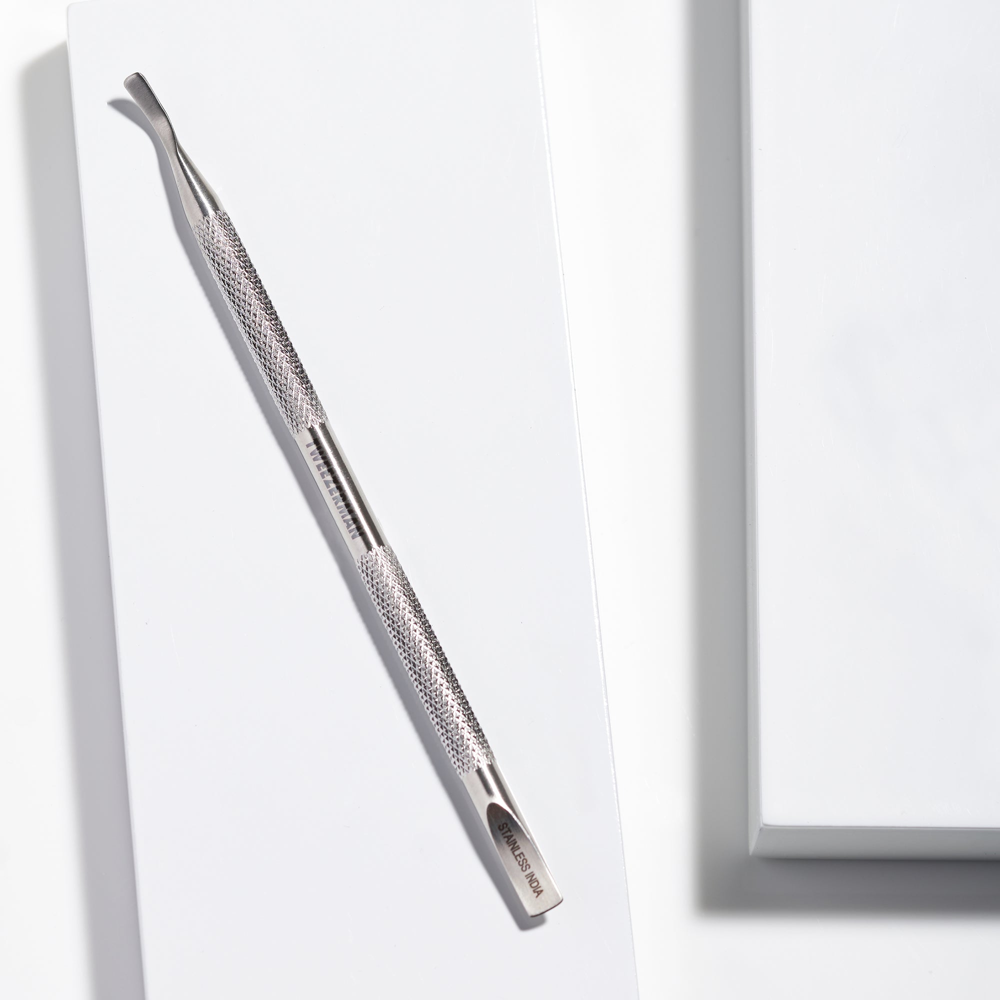 Female Model using nail cleaner of Dual Ended Stainless steel nail cleaner