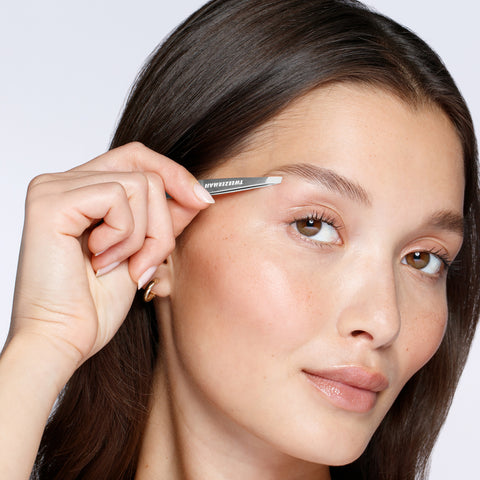 Male Model using Classic Mini Slant Tweezer on brows
