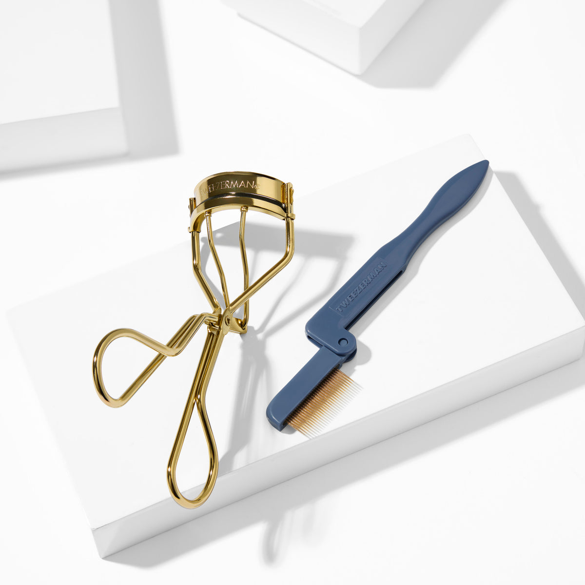 Evening Glow Lash Gift Set placed on a white block tray