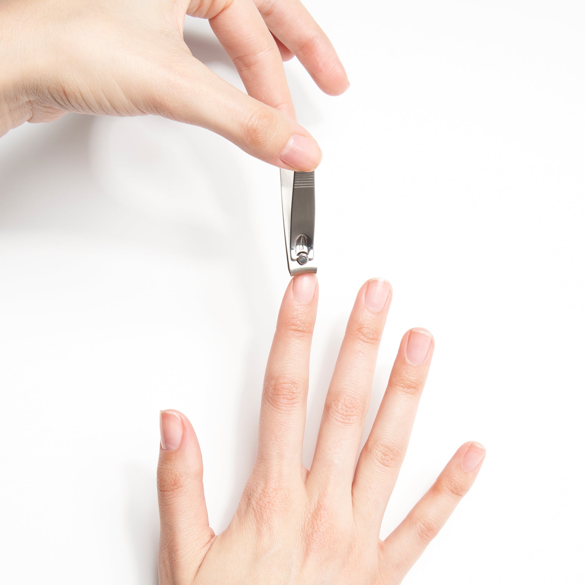 Model using Clipper Set Stainless on hand nails