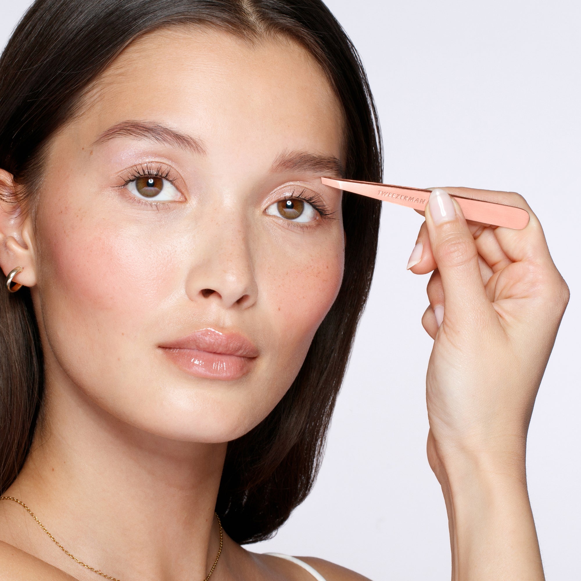Model using Rose Gold Slant Tweezer
