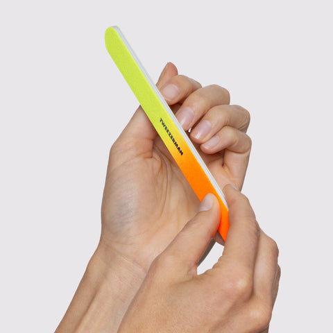 MODEL USING Neon Nail Kit's Neon File Set and filing fingernails